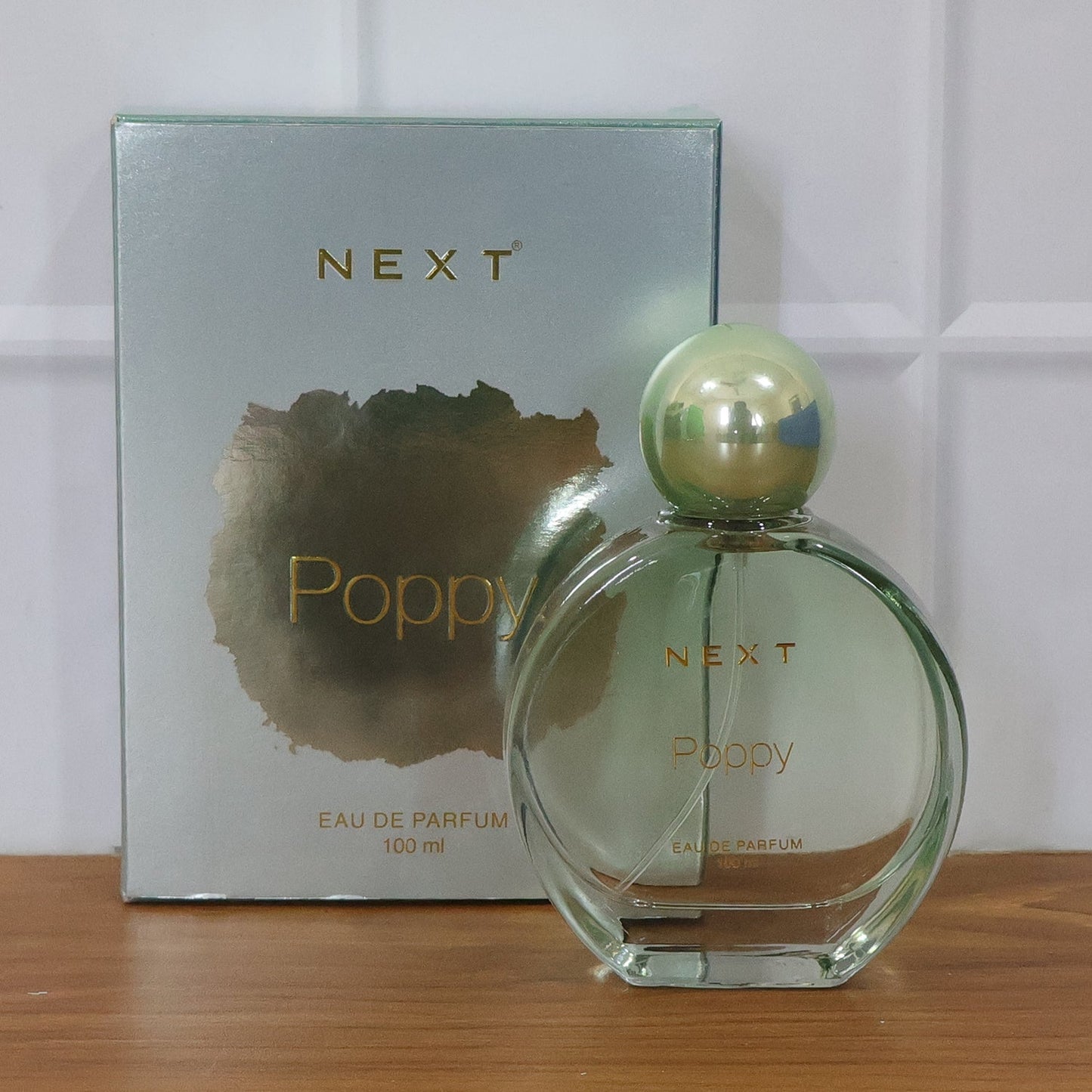 Next Poppy fragrance bottle front view