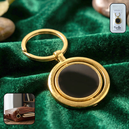 gold plated keychain with black round rotating pendant