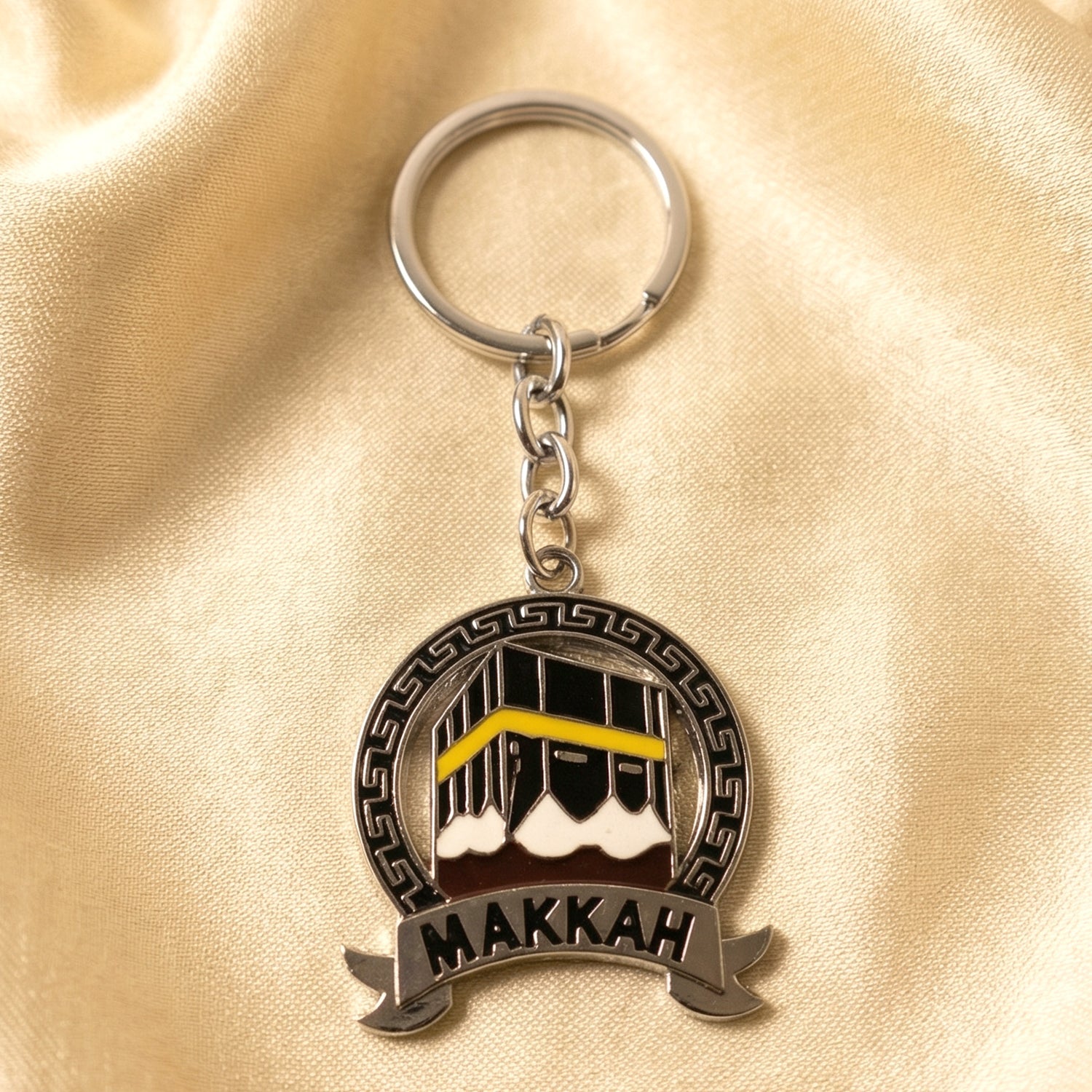 round metal keychain with Makkah mosque design