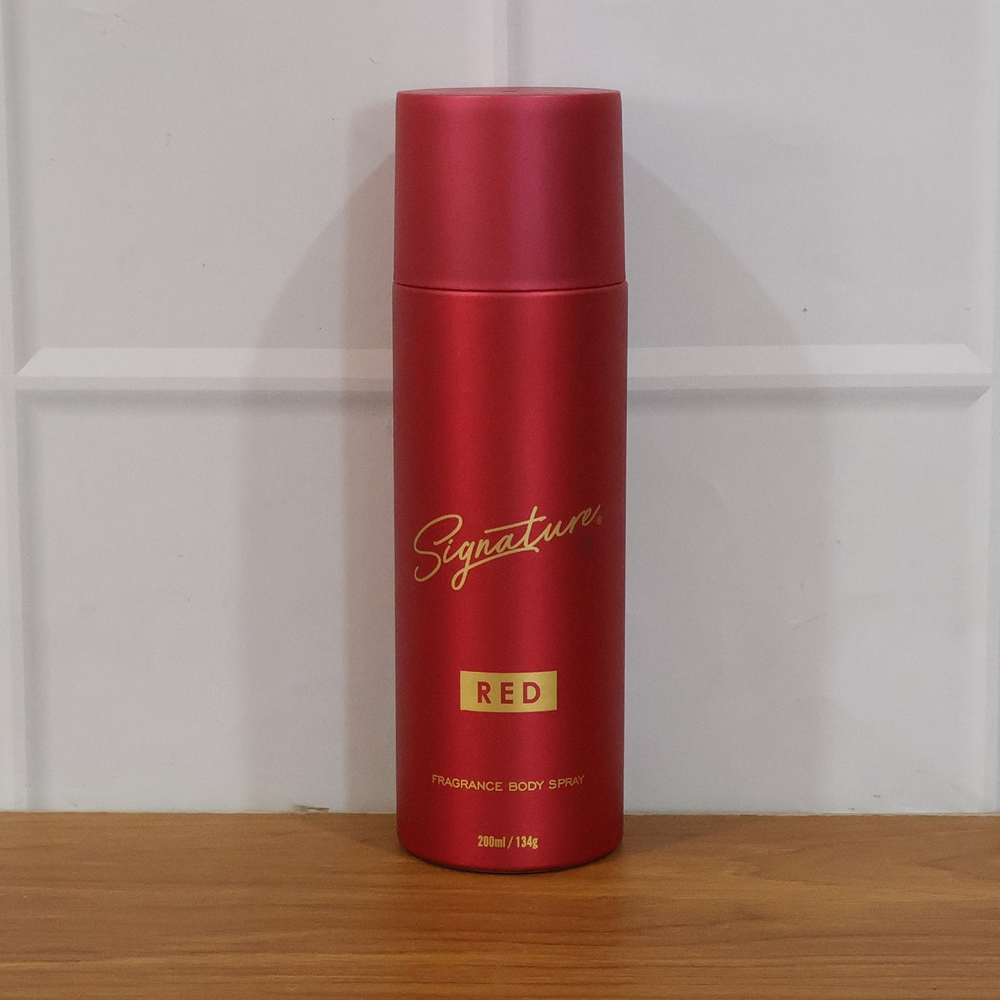 Signature red fragrance spray bottle design
