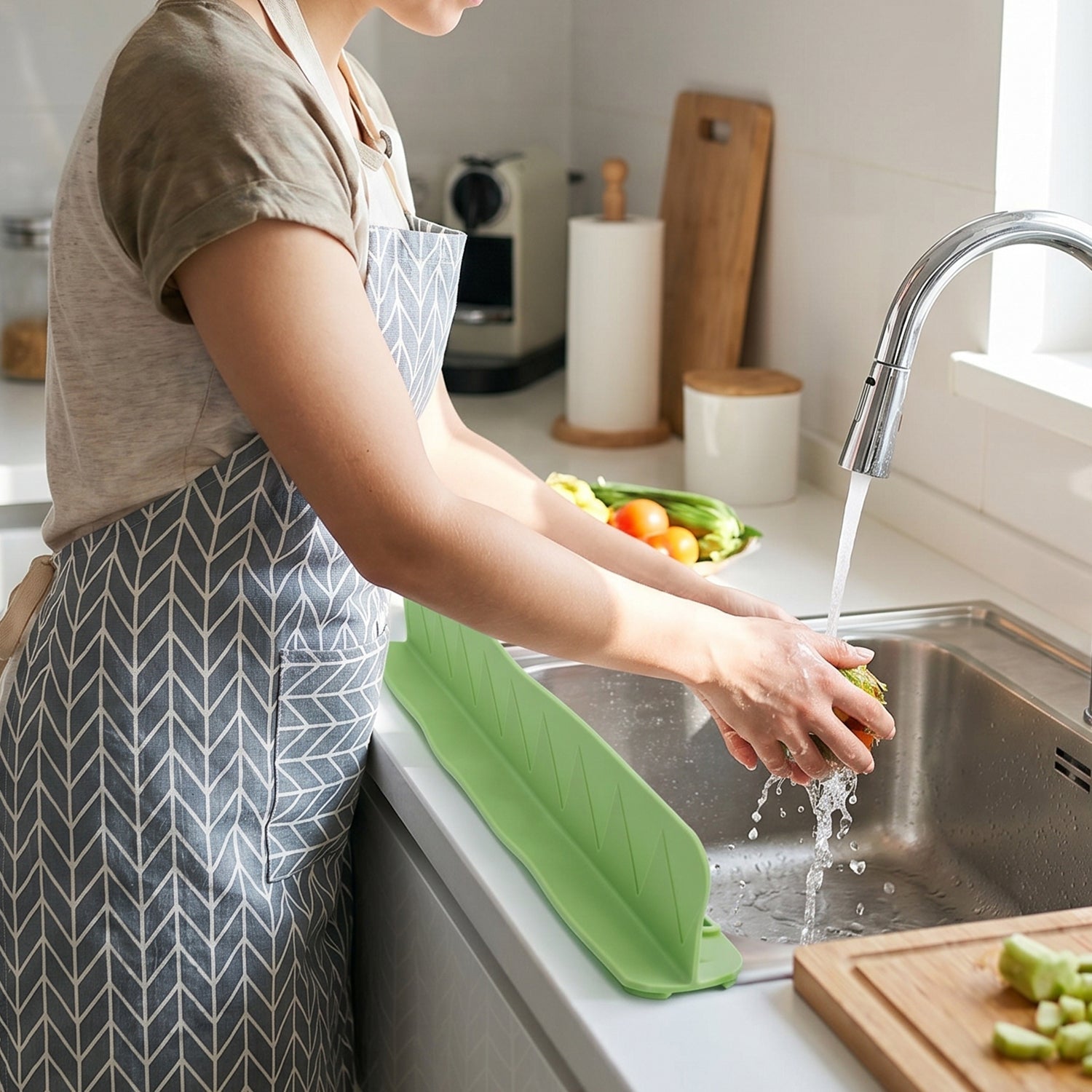 Splash guard in use washing vegetables