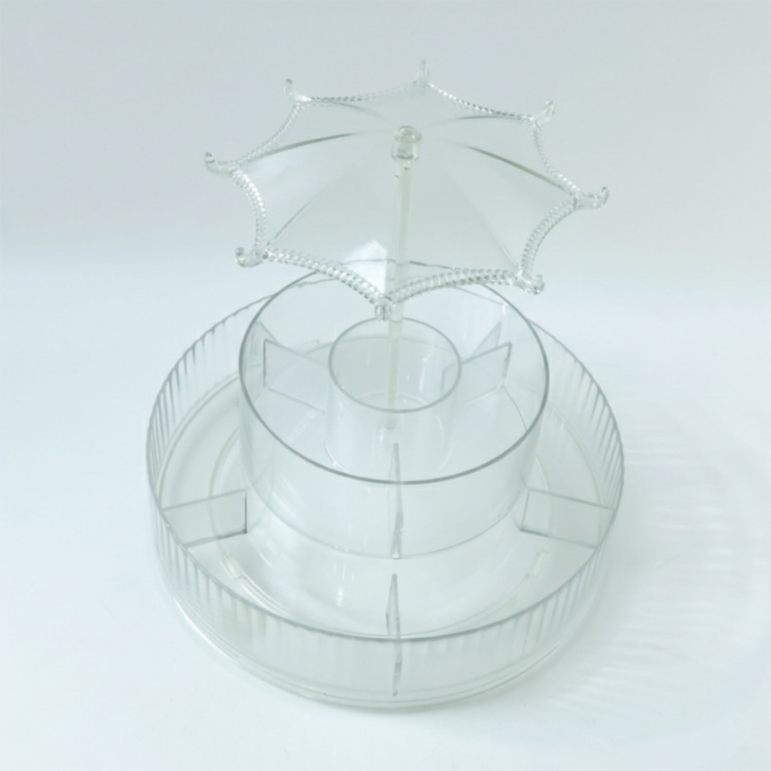 Spinning makeup and jewellery holder