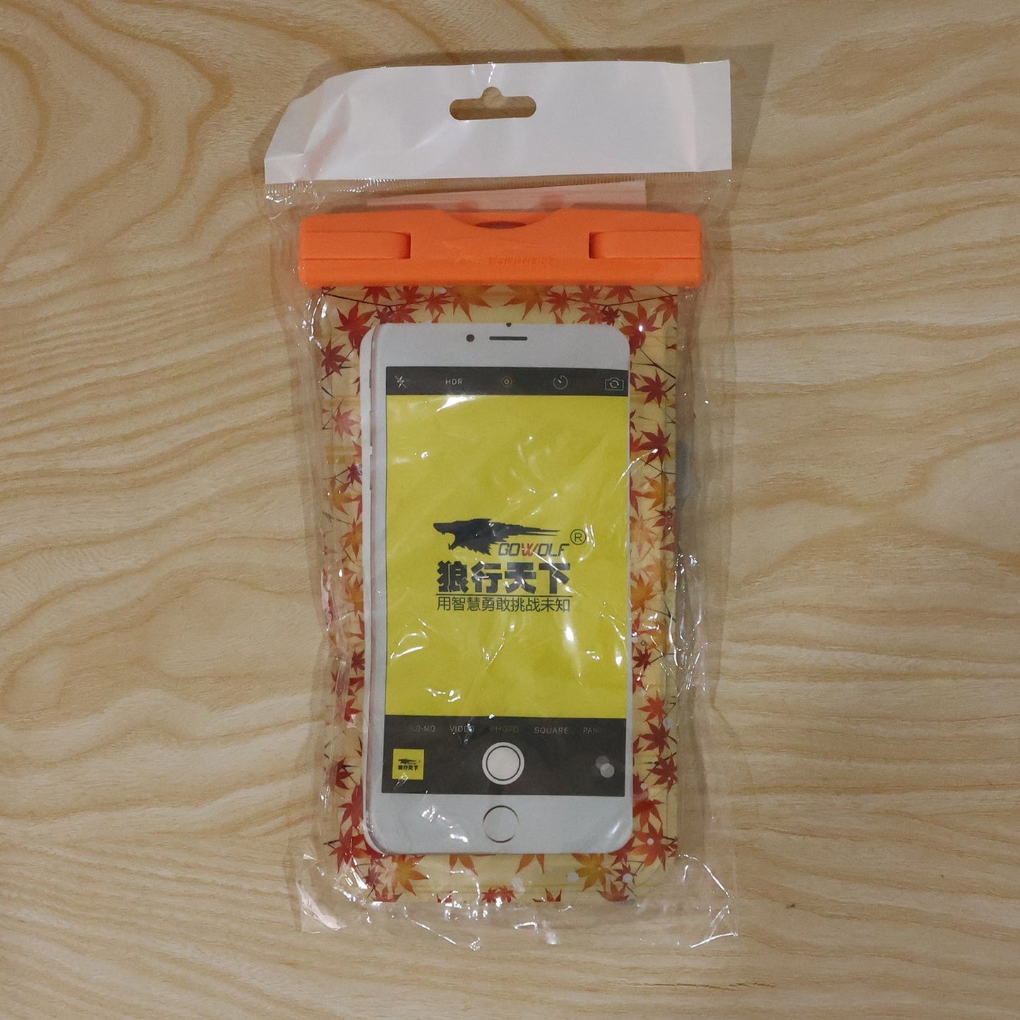 Orange maple leaf waterproof pouch lifestyle shot
